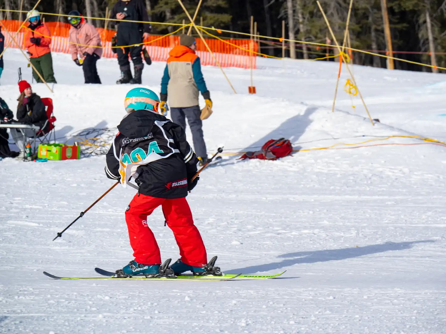 skier switch skiing into a jump at norquay