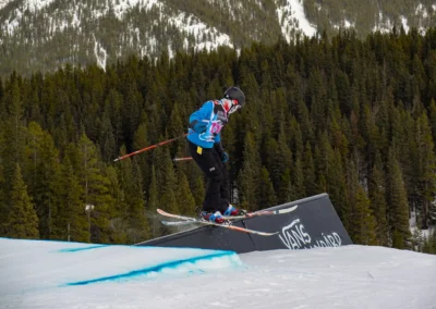 skier sliding a rail