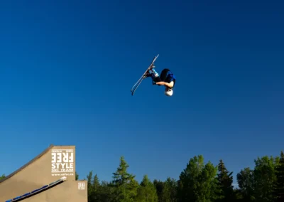 skier doing front flip on water ramps in red deer