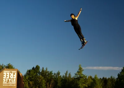 skier spinning on water ramps in red deer