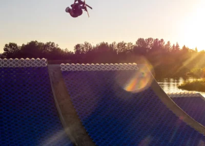 skier inverting on water ramp facility