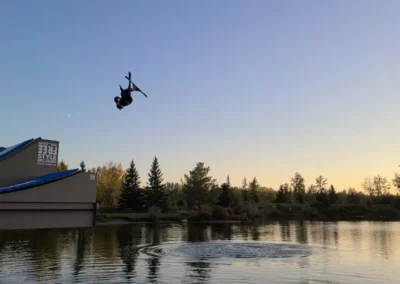 skier flipping on water ramps red deer