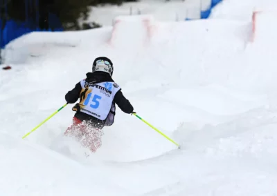 young mogul skier from behind